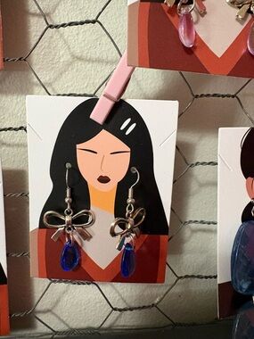 Silver Bow Earrings with Blue Teardrop Dangles